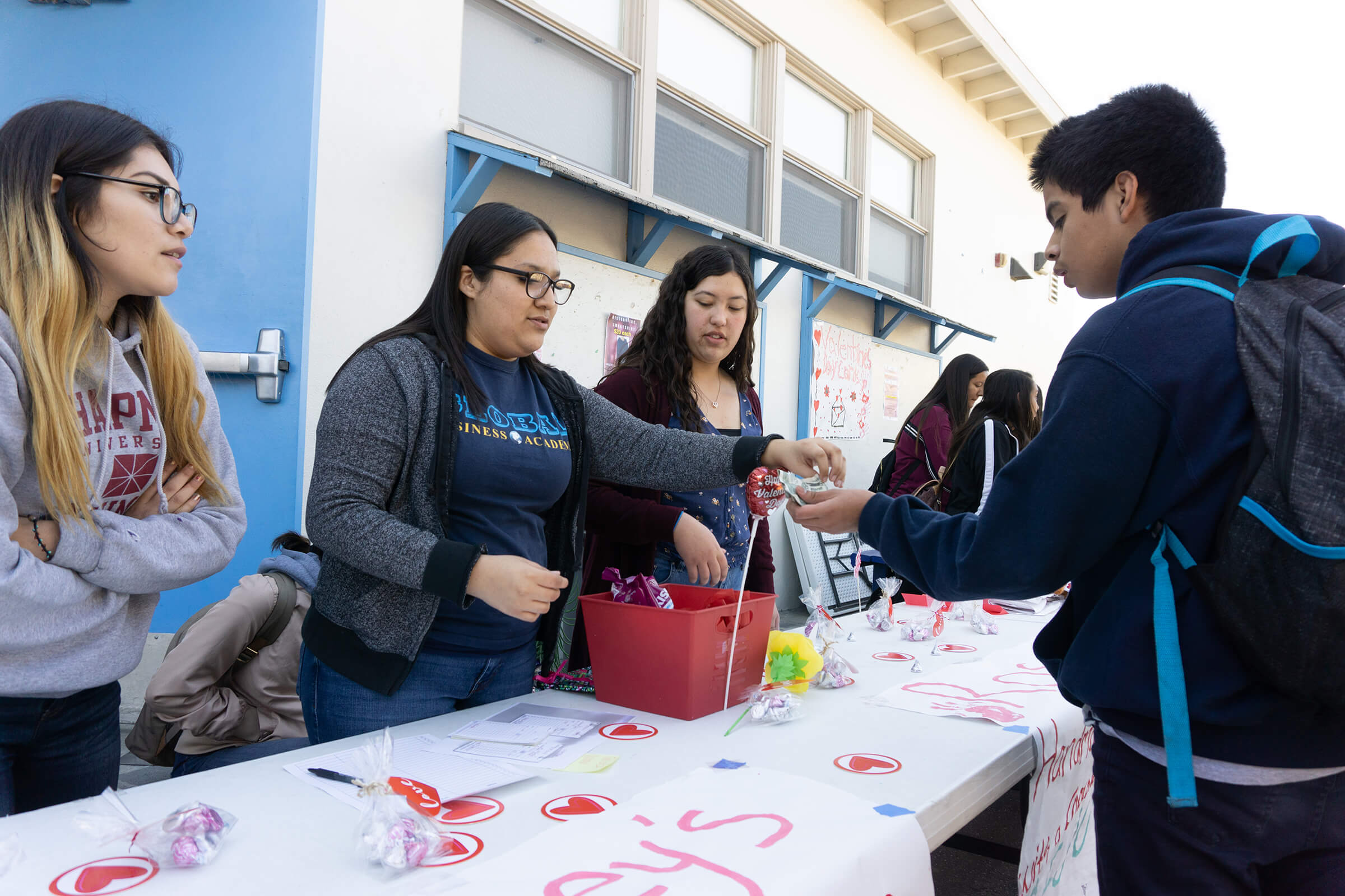 Global business students put on a fundraiser for Valentine's Day and facilitate purchasing and money transfer.