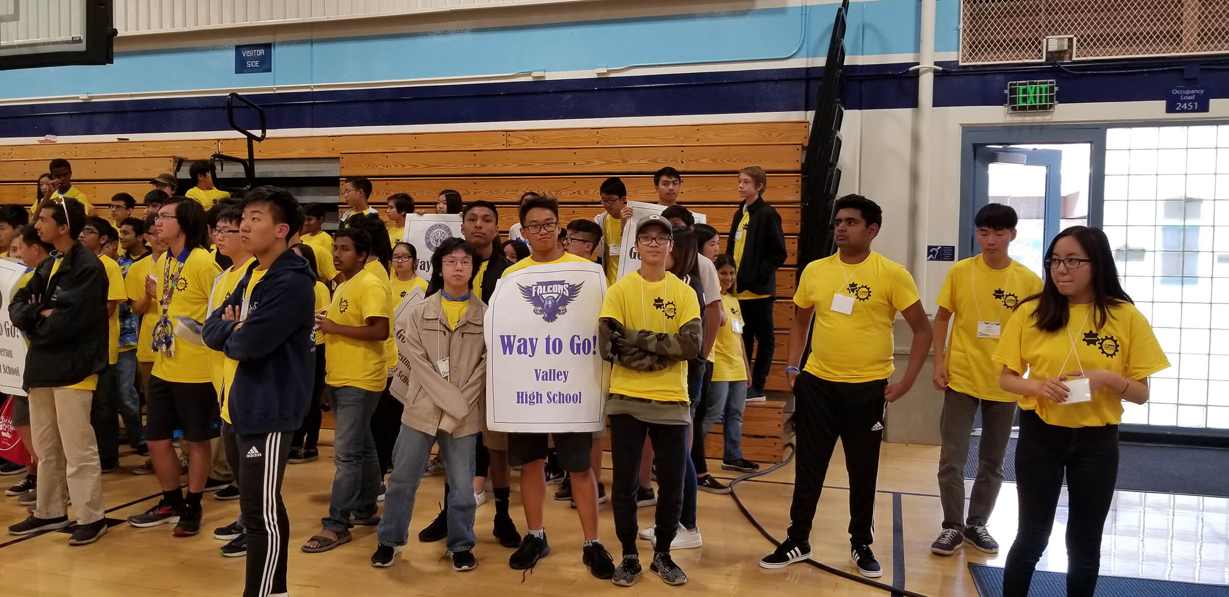Engineering and computer science students gather in the gymnasium to cheer on the Valley High School Falcons.